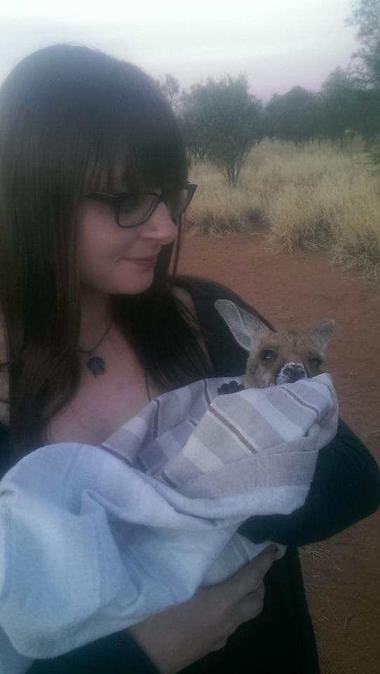Kangaroo Sanctuary Alice Springs holding a joey